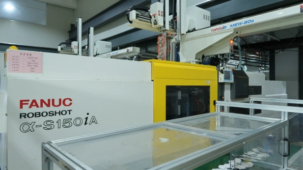 High-performance FANUC automated injection molding machine in operation at Ivans facility